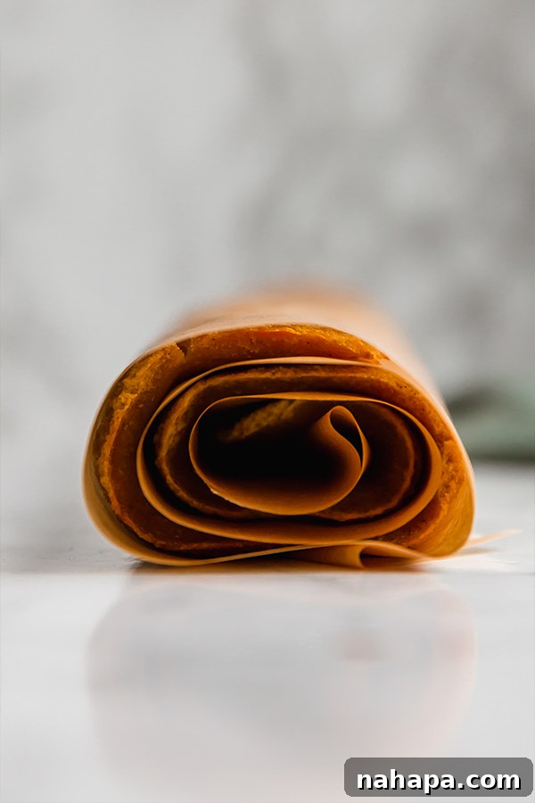 warm pumpkin cake rolled in parchment paper