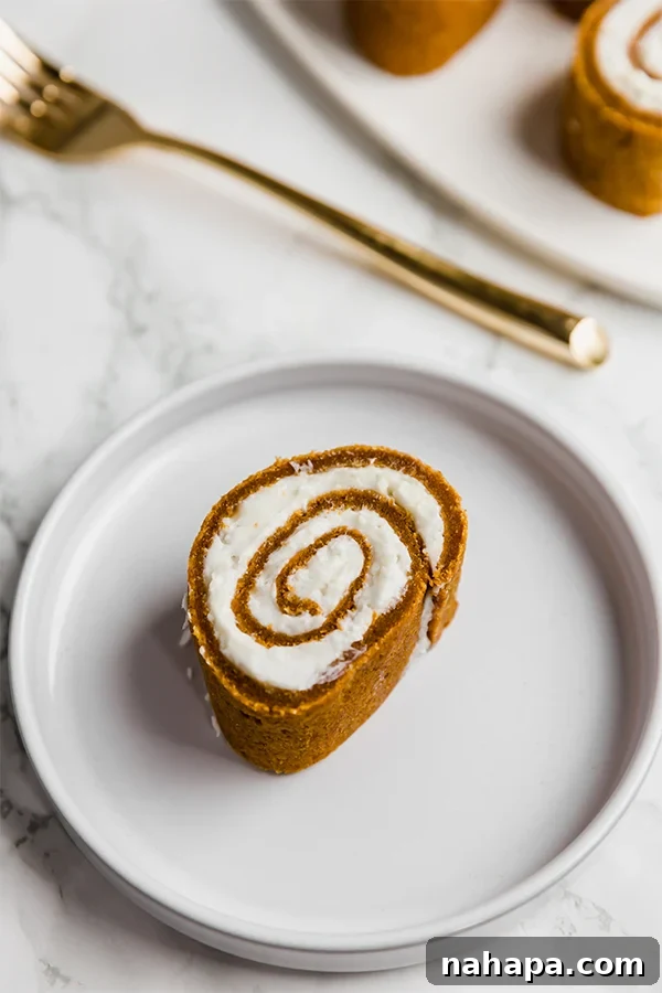 paleo pumpkin roll cake slice