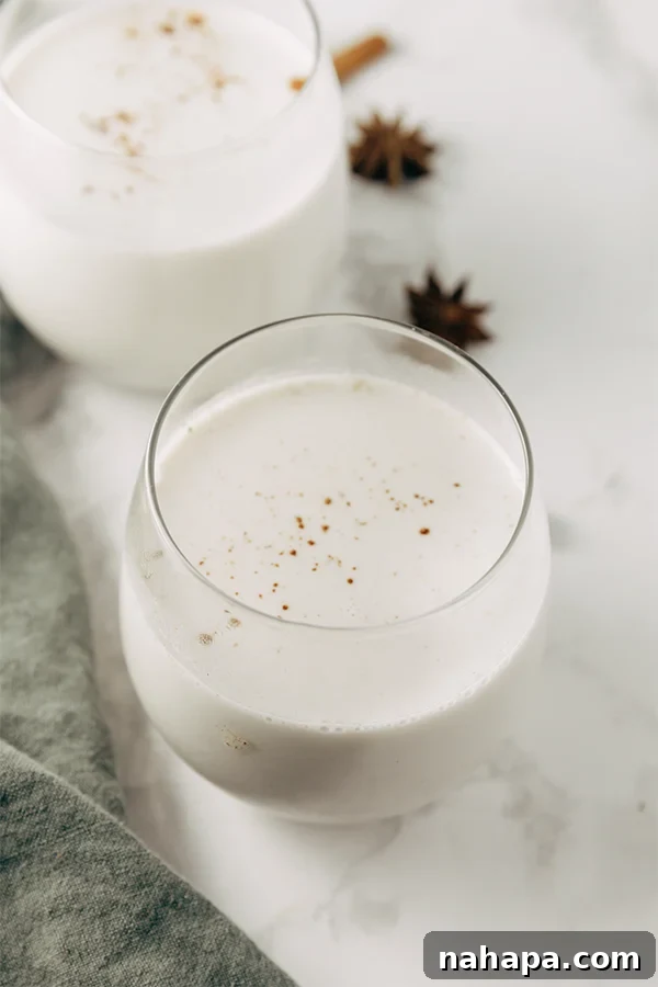 Virgin Paleo Nog 2 Delicious non-alcoholic paleo eggnog served in festive glasses, garnished with cinnamon