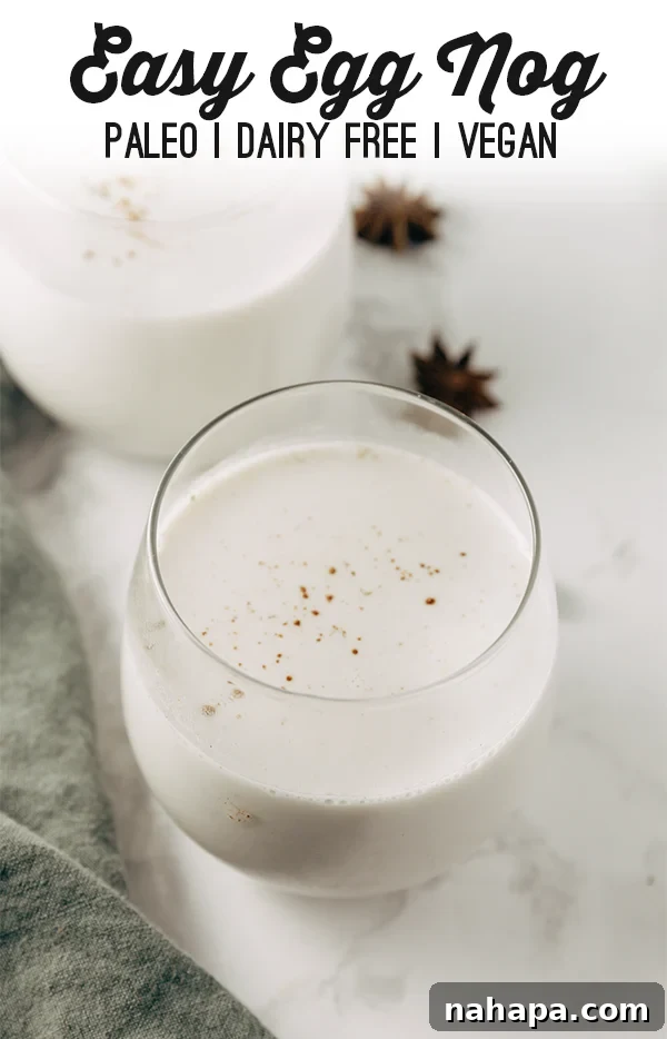 Virgin Paleo Nog 4 Festive flat lay of paleo eggnog glasses with a pine cone and holiday decor