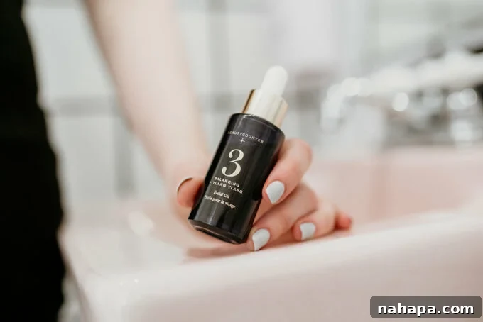 Beyond the Hype A Candid Beautycounter Look 3 Two Beautycounter skincare products, likely the balancing oil and a moisturizer, with a plant in the background.
