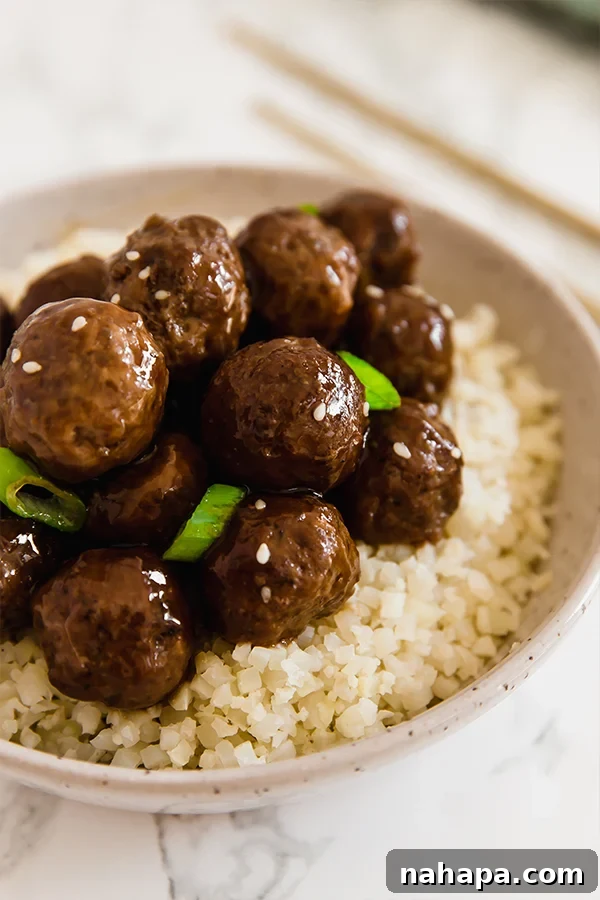 Mongolian Meatballs served over cauliflower rice with green onions