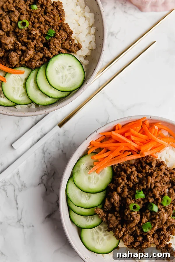Korean Ground Beef Bowls close up with fresh garnishes