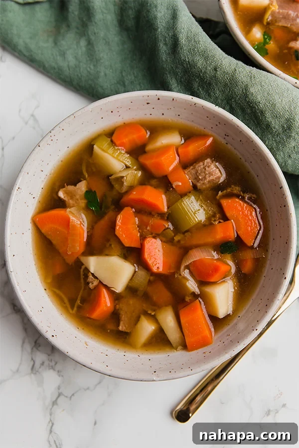 Close-up of the cooked slow cooker beef stew, highlighting the tender beef and vegetables