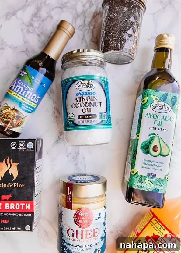 An organized pantry shelf displaying various Paleo-friendly cooking oils, baking ingredients, and cooking staples from Sprouts.