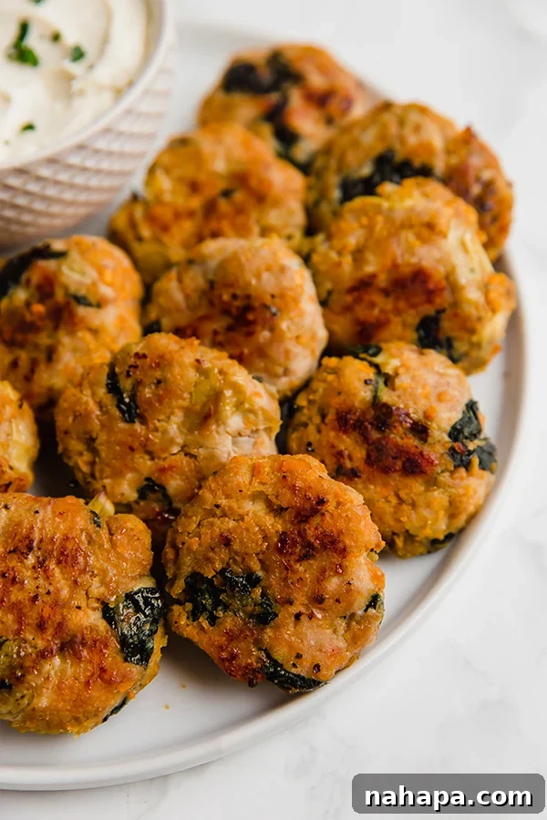 Creamy Spinach Artichoke Chicken Sweet Potato Bites 2 Delicious Spinach and Artichoke Sweet Potato Chicken Poppers, perfect for healthy eating
