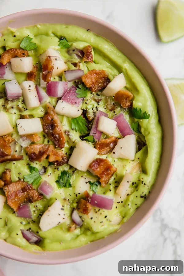 Applewood Bacon Guacamole 2 Creamy Apple Bacon Guacamole topped with fresh ingredients like cilantro, bacon, and diced apple