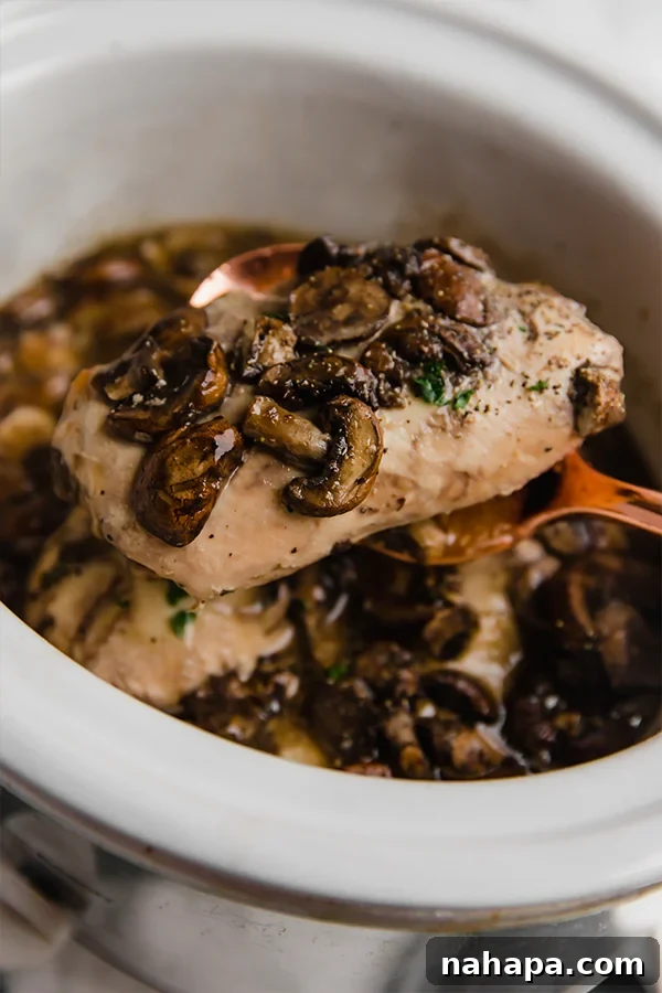 Close-up of Slow Cooker Chicken Marsala in the pot, showcasing the rich sauce, tender chicken, and mushrooms.