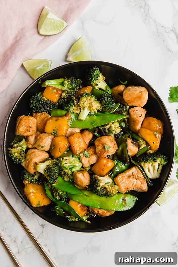 Close-up of Mango Chicken Stir Fry in a skillet