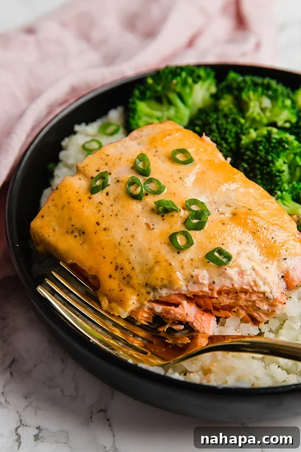 Bang Bang Salmon Bowls with fresh salmon, vegetables, and creamy sauce.
