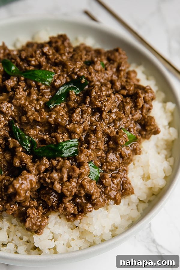 A plate of quick and easy Mongolian ground beef with green onions.