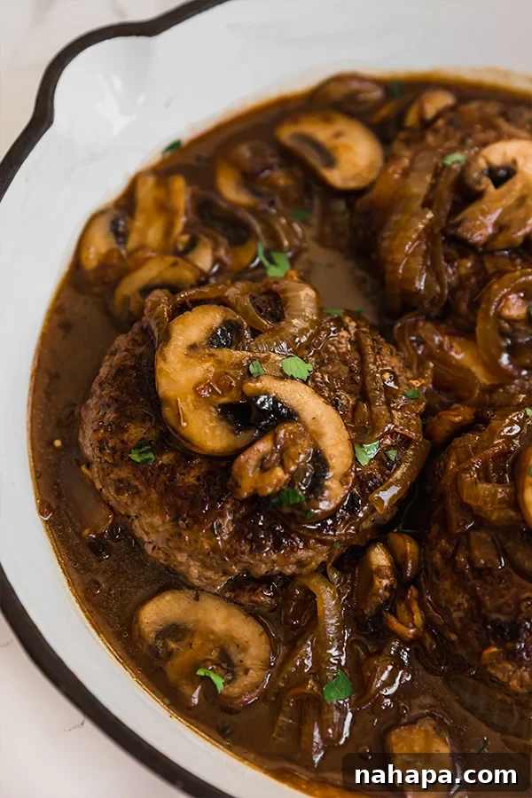 Healthy Two Week Quarantine Eating Guide and Grocery List 11 Paleo Hamburger Steak served with mashed sweet potatoes.