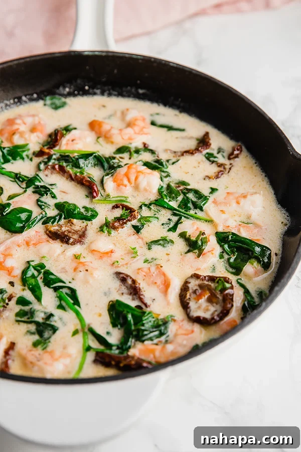 Healthy Two Week Quarantine Eating Guide and Grocery List 12 Tuscan Garlic Shrimp Skillet, made with frozen shrimp and coconut milk.