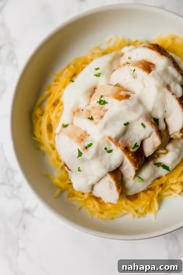 Healthy Two Week Quarantine Eating Guide and Grocery List 8 Spaghetti Squash Chicken Alfredo, a healthy, dairy-free version.