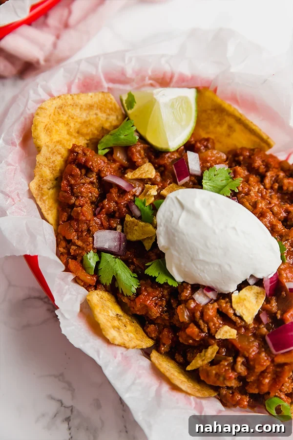 Healthy Two Week Quarantine Eating Guide and Grocery List 9 Paleo Frito Pie made with ground beef and plantain chips.