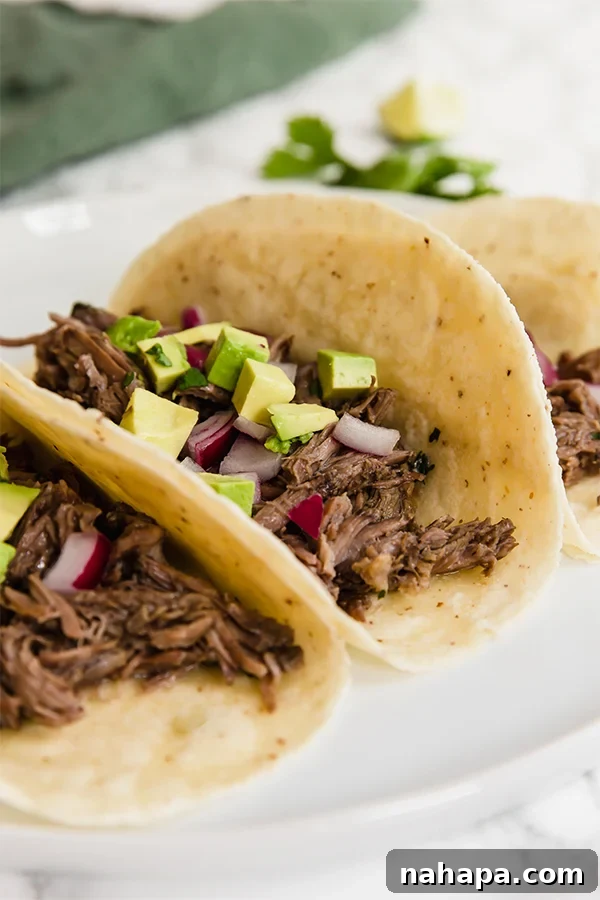 Shredded Slow Cooker Barbacoa in a serving dish