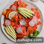 Top-down view of Plantain Chilaquiles with toppings