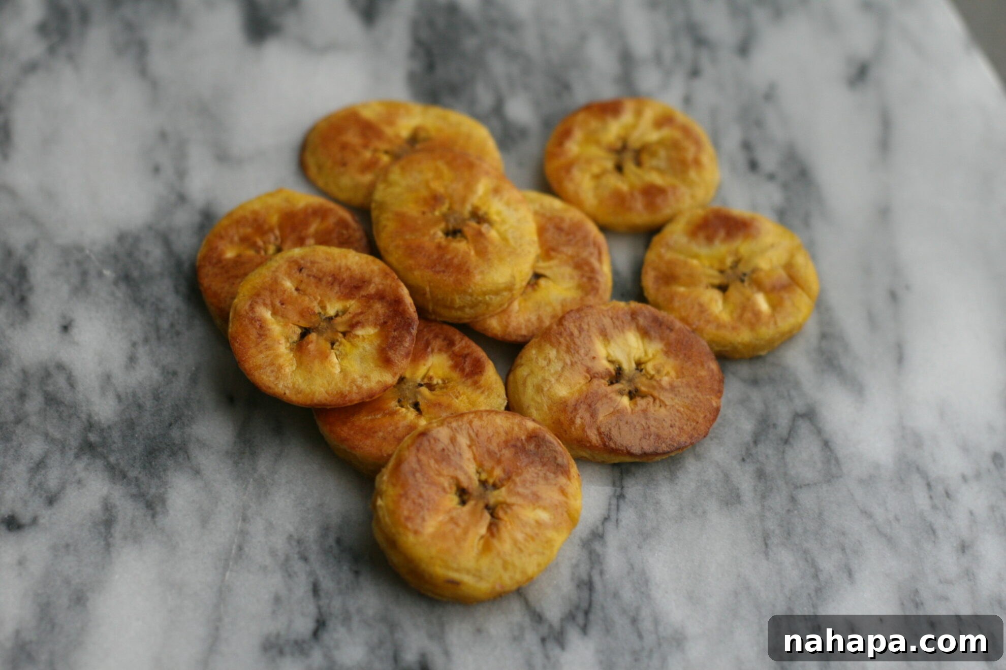 Autoimmune-Friendly Oven Baked Plantains 5 Close-up of freshly baked golden plantains, seasoned and ready to eat.
