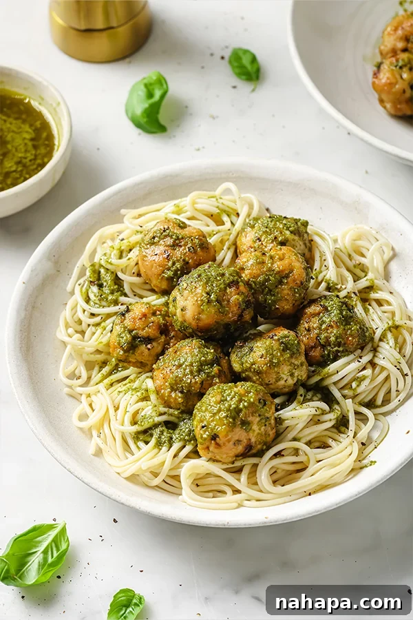 Garden Fresh Turkey Pesto Meatballs 5 Cooked turkey pesto meatballs generously topped with green pesto and fresh basil leaves.