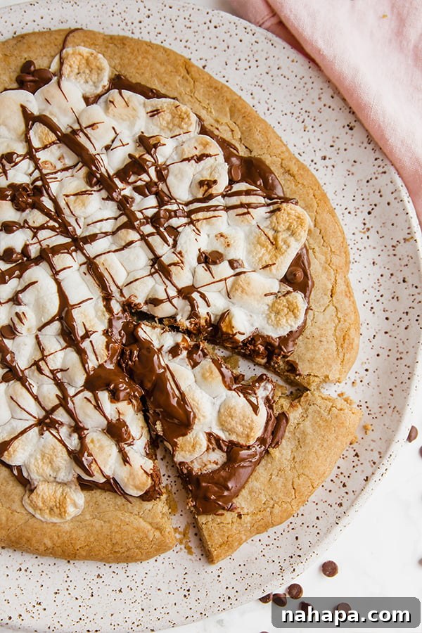 S'mores Pizza: Gluten-Free Indulgence 4 Close-up of a slice of S'mores Pizza ready to be eaten