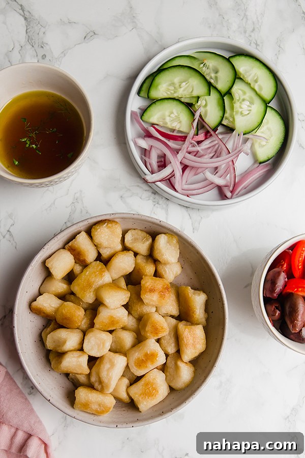 Hellenic Gnocchi Bowl 3 Assortment of fresh vegetables and cauliflower gnocchi for the salad