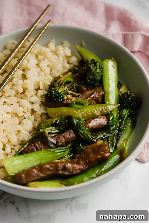 Beef stir fry in bowl with cauliflower rice
