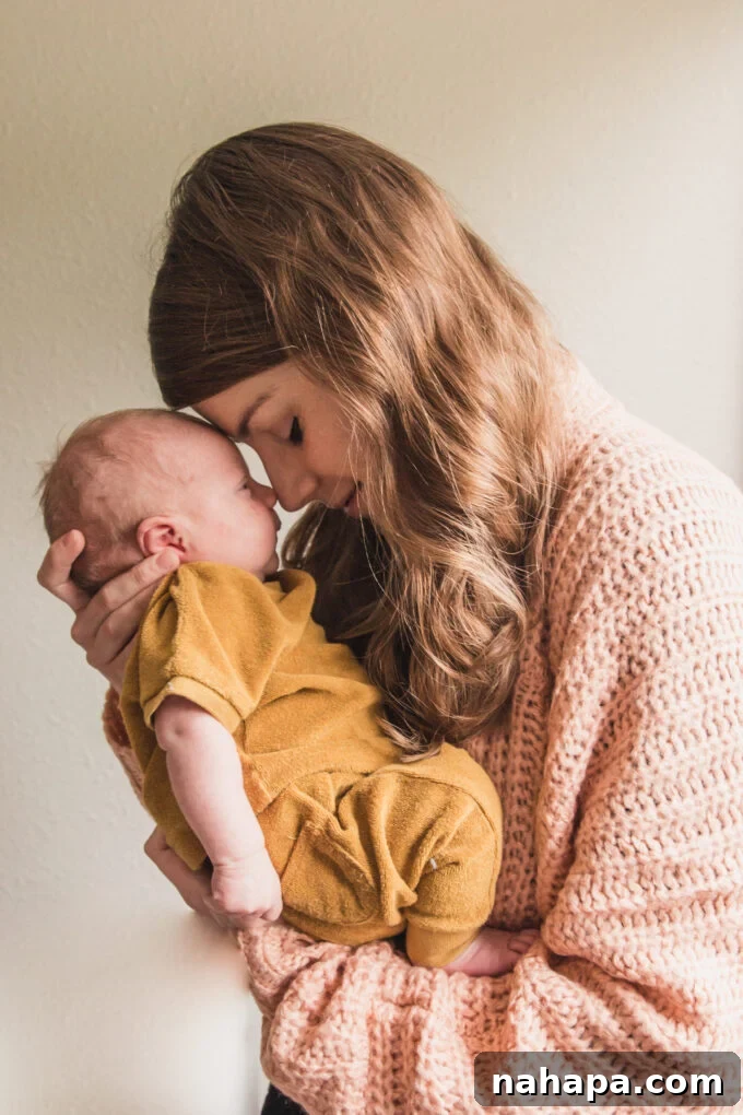 A beautiful newborn baby, peaceful and wrapped, symbolizes the culmination of a challenging birth journey.