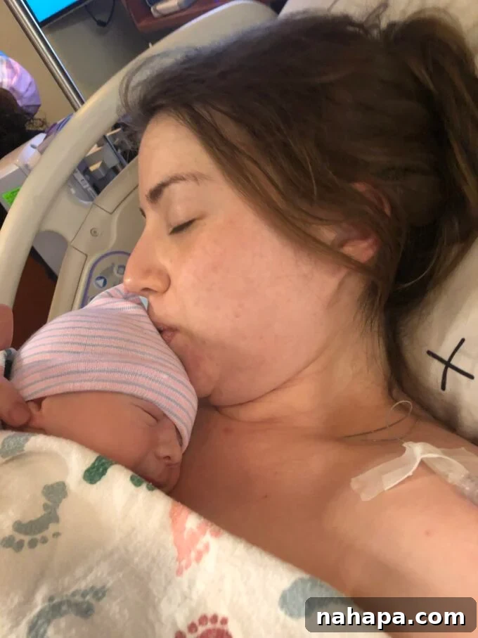 A heartwarming image of a newborn baby resting peacefully on a parent's chest, a moment of pure bliss after a challenging labor.