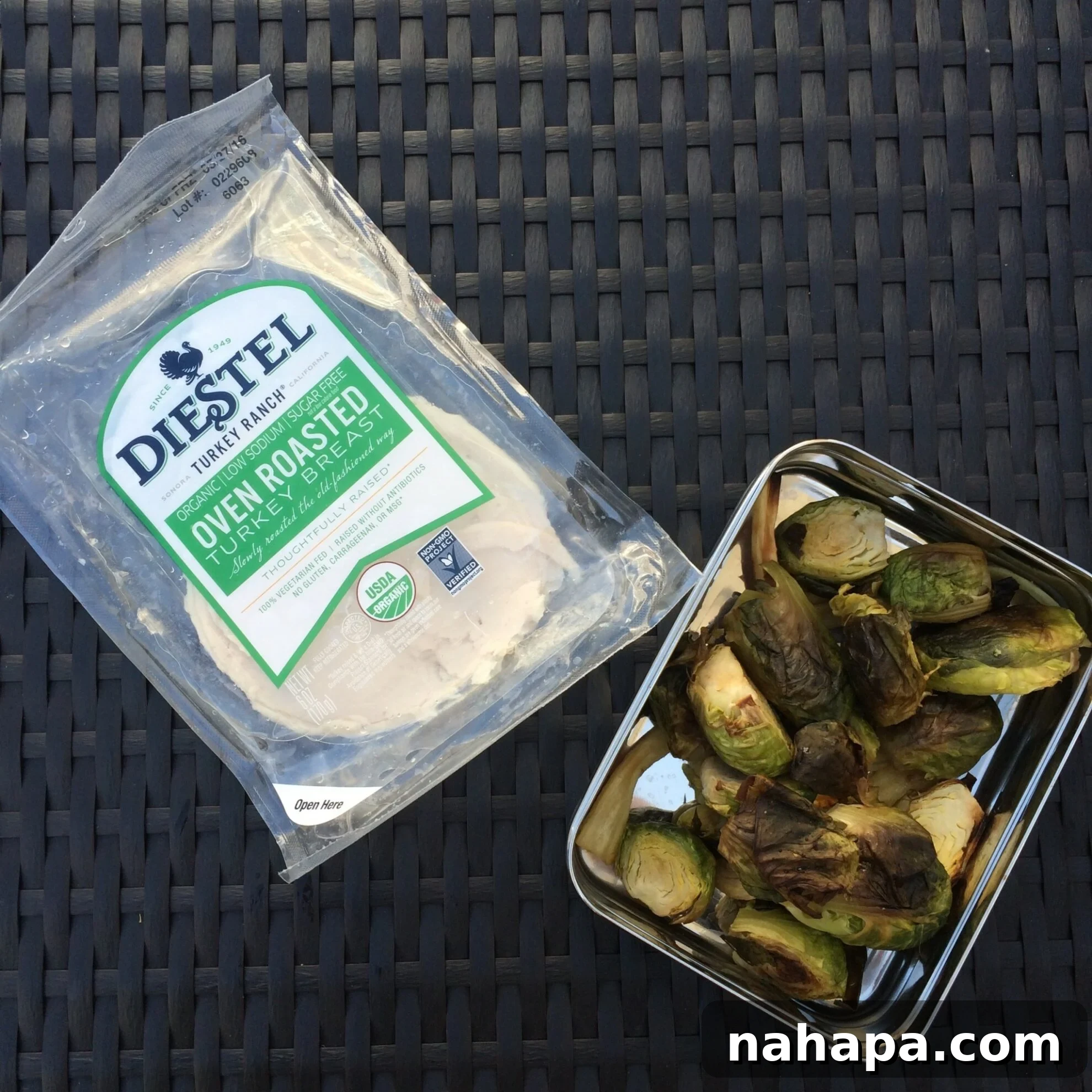 An AIP-friendly lunch plate featuring perfectly roasted Brussels sprouts, savory parsnips, luscious sliced avocado, and succulent turkey, demonstrating the variety and deliciousness of compliant travel meals.