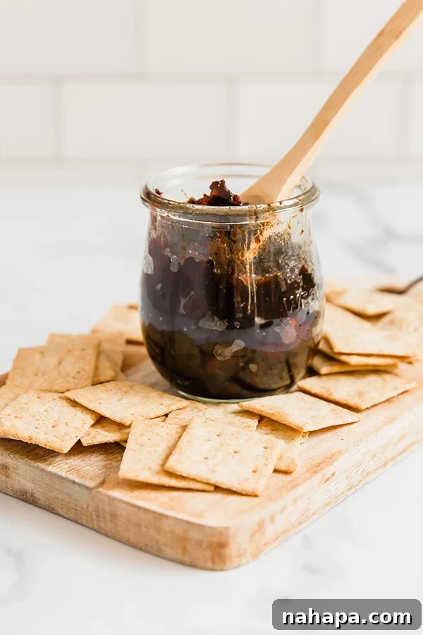 Caramelized Apple Bacon Delight 3 Apple Bacon Jam in a glass jar, perfectly cooked and ready to be stored or served
