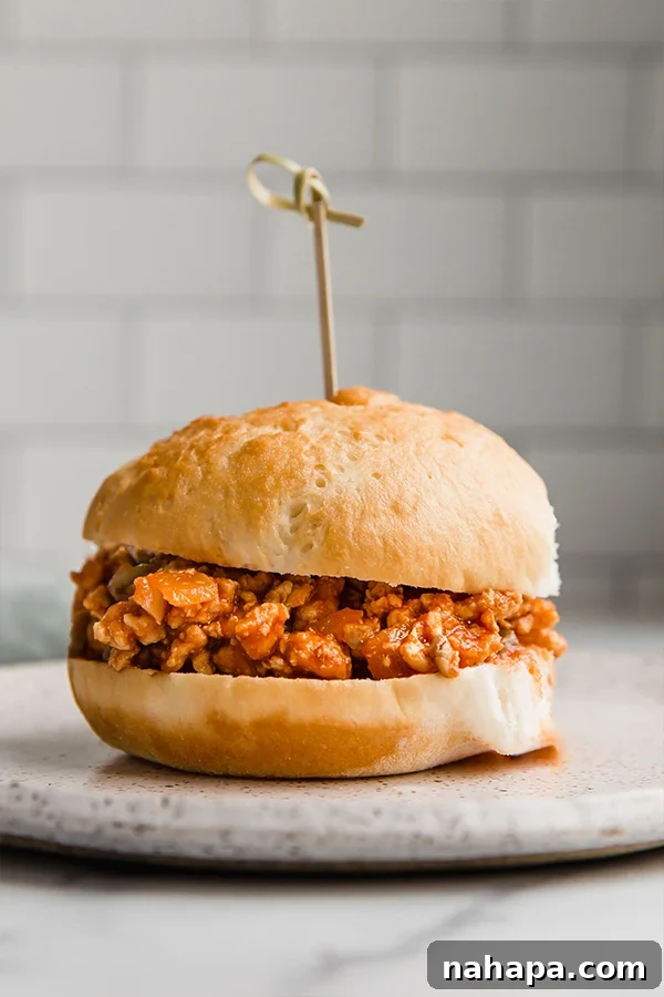 Wholesome Turkey Sloppy Joe Paleo AIP Whole30 5 Close-up of a delightful turkey sloppy joe served between two slices of gluten-free bread, secured with a toothpick.