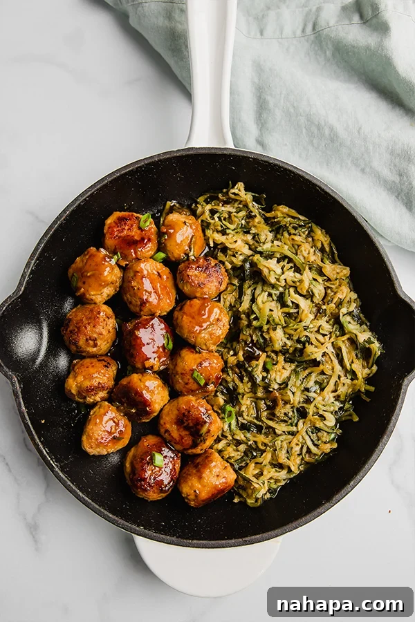 teriyaki turkey meatballs in skillet with zucchini noodles