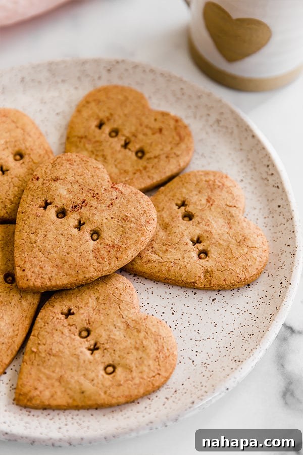 A plate full of Paleo and AIP Conversation Heart Sugar Cookies, ready for sharing.