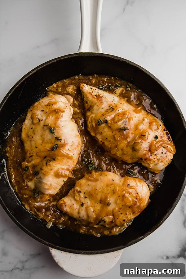 Paleo and AIP French Onion Chicken 3 French onion chicken in cast iron skillet, bubbling with deliciousness