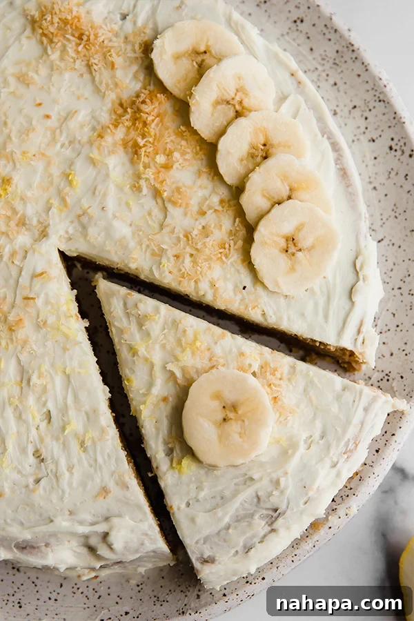 Close-up of a slice of Paleo Vegan Coconut Flour Lemon Banana Cake, showing its moist, tender texture
