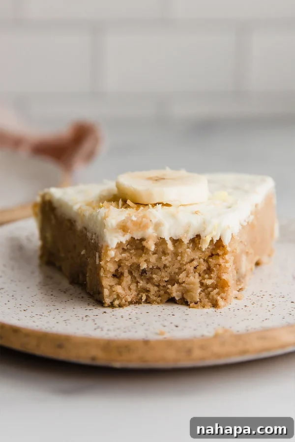 Coconut Flour Banana Cake with frosting and toppings