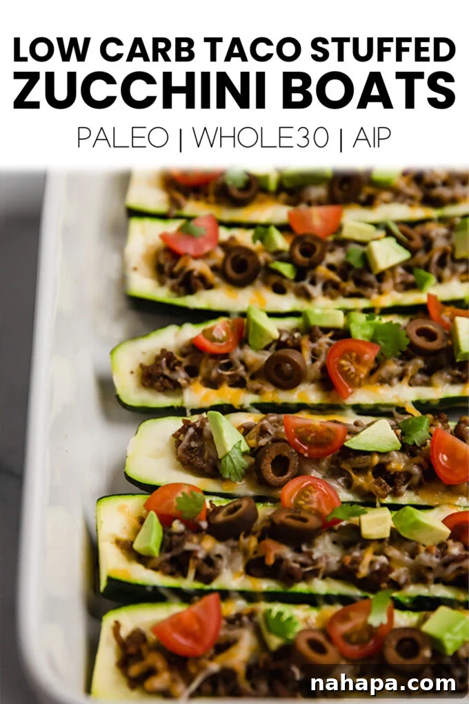 Savory Zucchini Taco Boats Low Carb Paleo Whole30 AIP 7 A large, appealing full-page image showcasing the finished taco stuffed zucchini boats, with text overlay, ready to inspire healthy meal choices.
