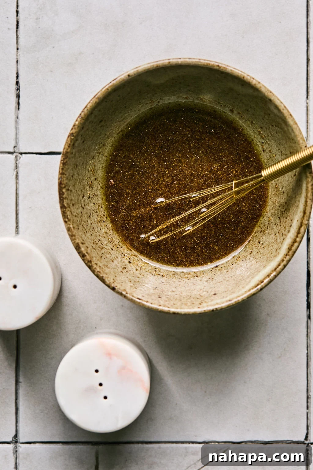 Avocado oil, coconut aminos, apple cider vinegar, salt, pepper, and garlic powder combined in a small bowl