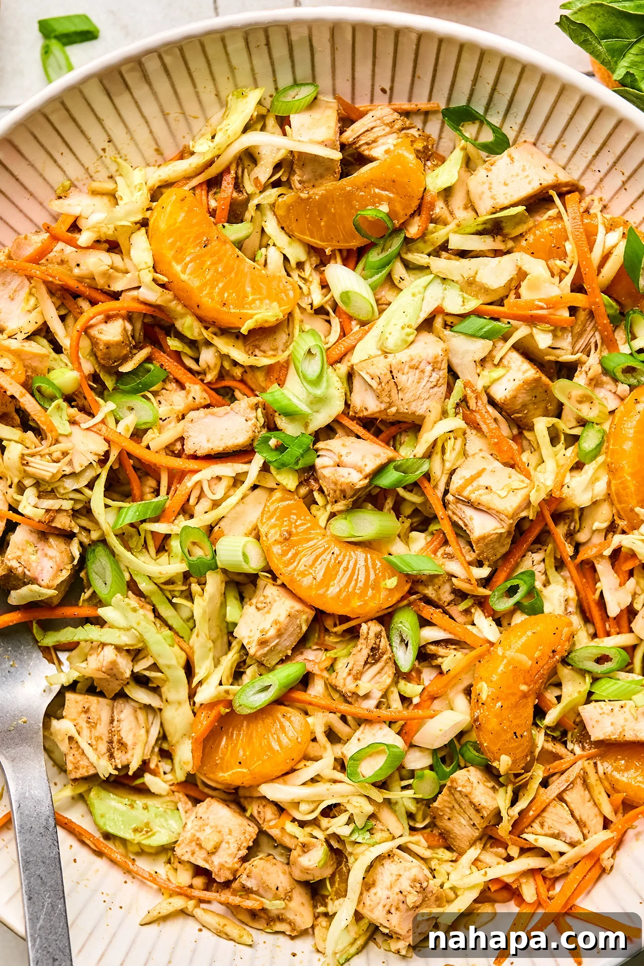 The finished Gluten-Free Chinese Chicken Salad, perfectly tossed and topped with green onion, ready to be served