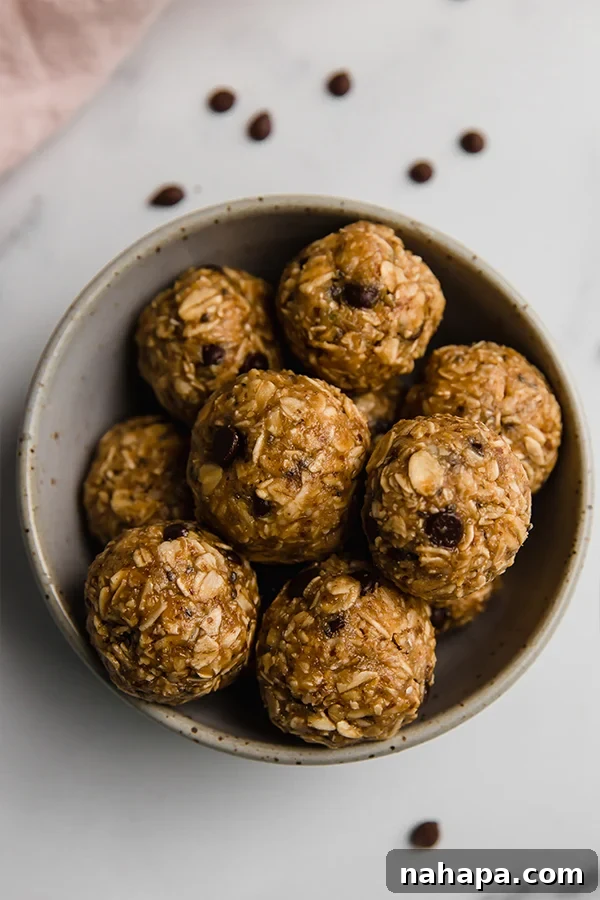 A beautifully styled shot of the finished energy bites in a rustic bowl, showcasing their delicious appeal.