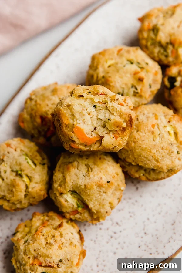 A plate of freshly baked gluten-free veggie muffins, ready to be enjoyed as a healthy snack.