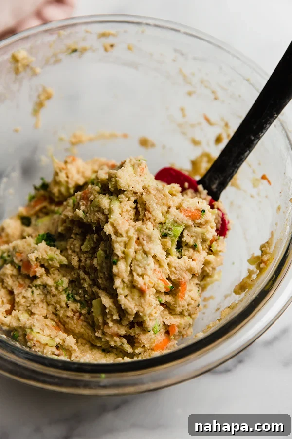 First step in baking: Dry ingredients for gluten-free veggie muffins are mixed in a large bowl.