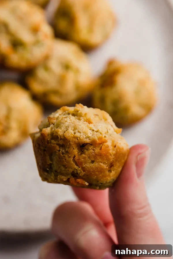 Freshly baked gluten-free veggie muffins cooling on a wire rack.