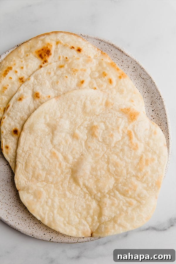 Tropical Paleo AIP Mango Chicken Tostadas 3 Crispy grain-free tortillas laid out on a plate, ready for topping