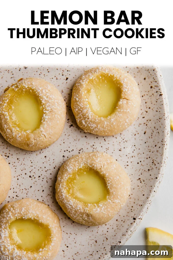 A beautifully composed shot of Lemon Bar Thumbprint Cookies, showcasing their vibrant color and texture, presented with a rustic aesthetic.