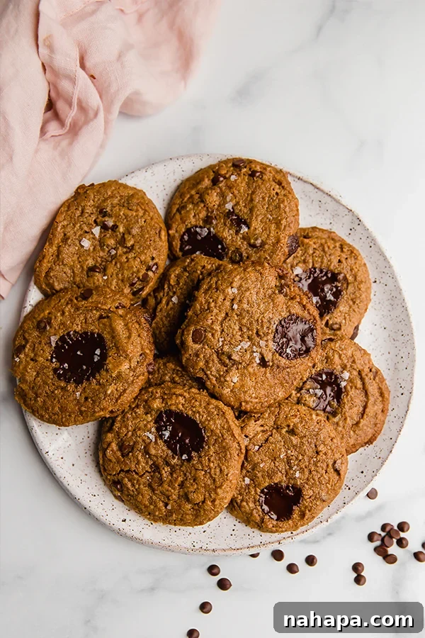 Soft and Chewy Paleo Vegan Almond Butter Cookies 6 almond butter cookies overhead on a plate