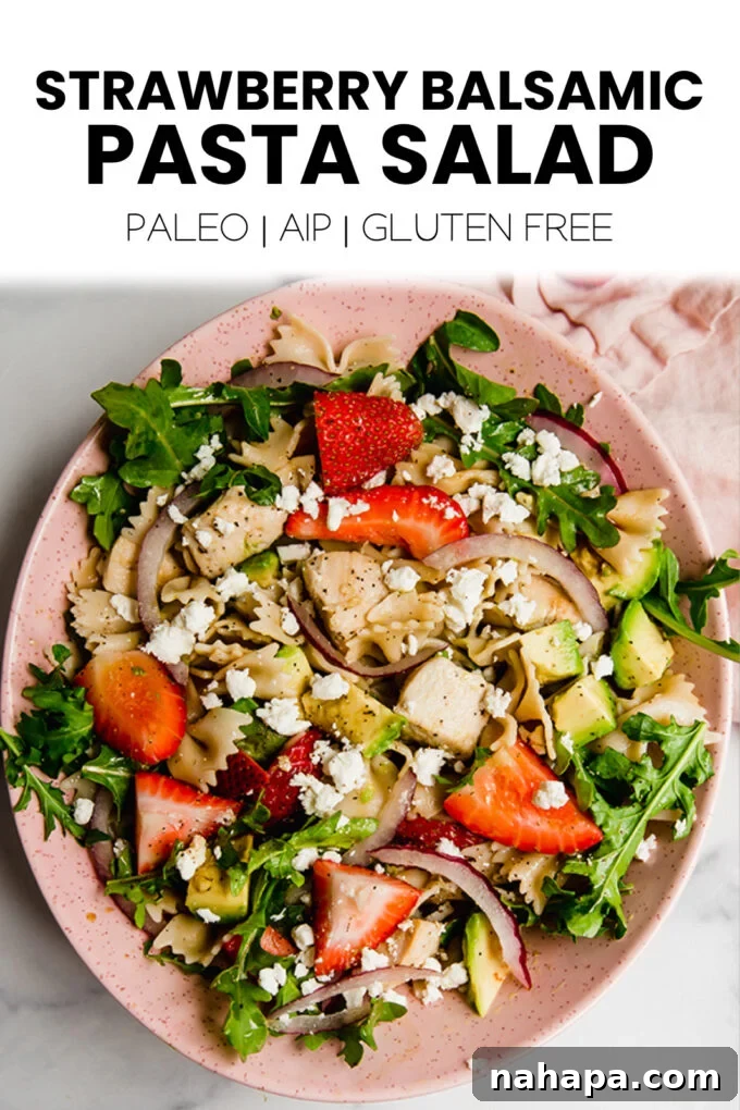 A vibrant overhead shot of the strawberry balsamic pasta salad, highlighting its fresh appeal and colorful ingredients.