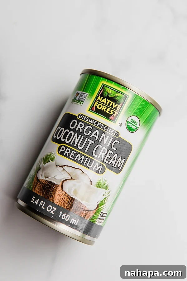 Canned coconut cream and water in a blender.