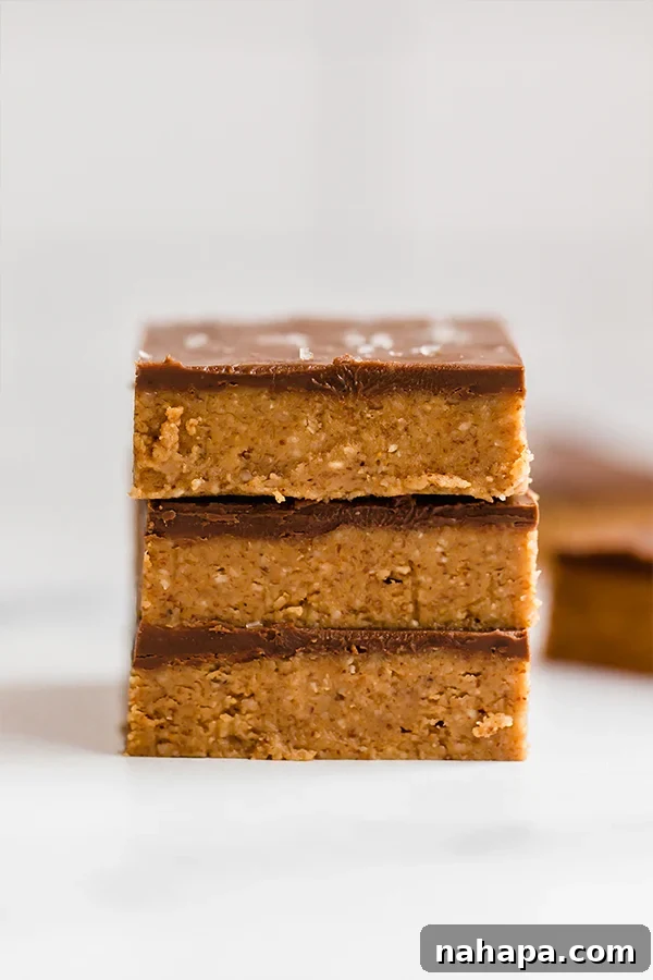 3 almond butter bars stacked on counter