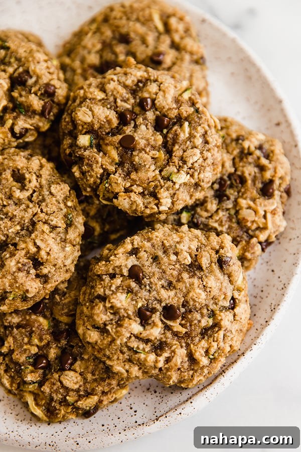 Oatmeal zucchini cookies stacked on a plate, ready to be enjoyed